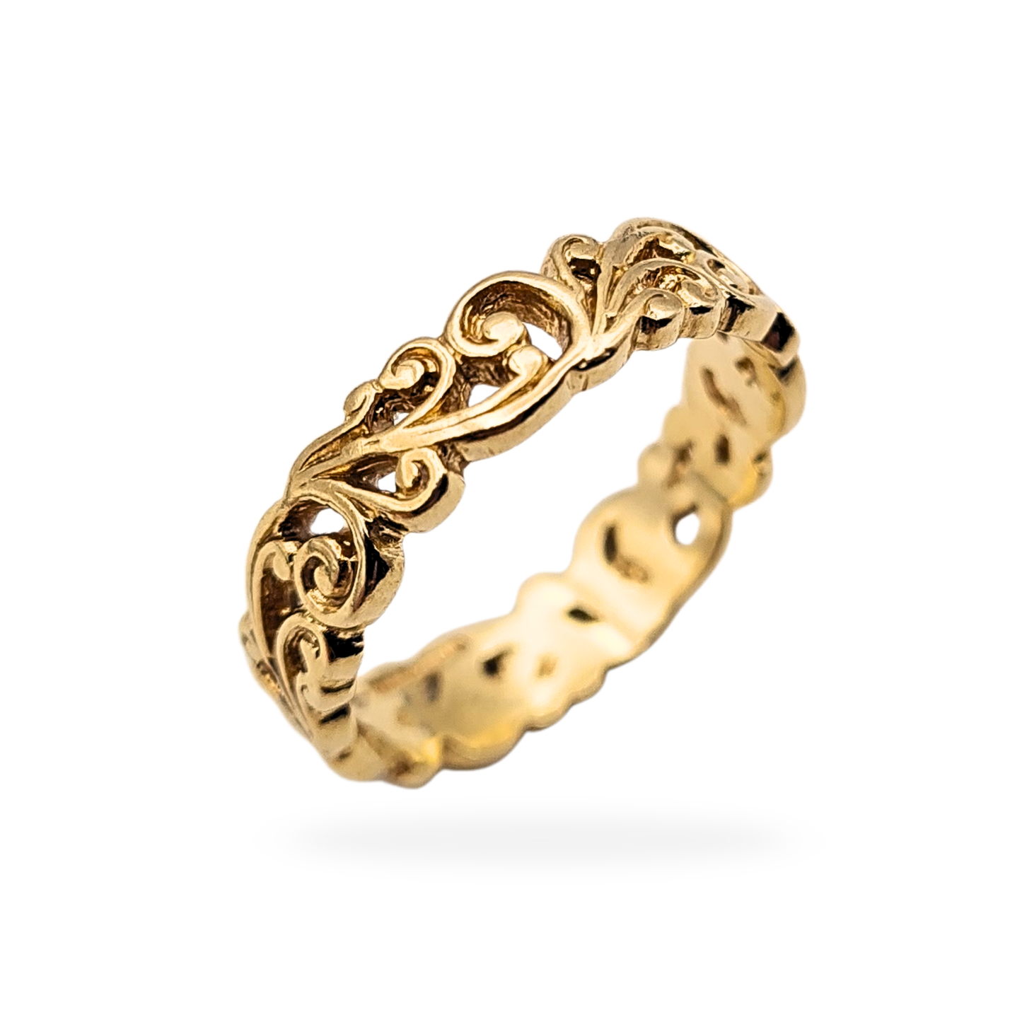 Vintage 9ct gold ornate scroll ring featuring floral and leaf openwork detailing, hallmarked in Birmingham. Solid gold band measuring 4.7mm wide, ring size UK M US 6 1/4, with warm vintage tone and well-defined decorative scrollwork.