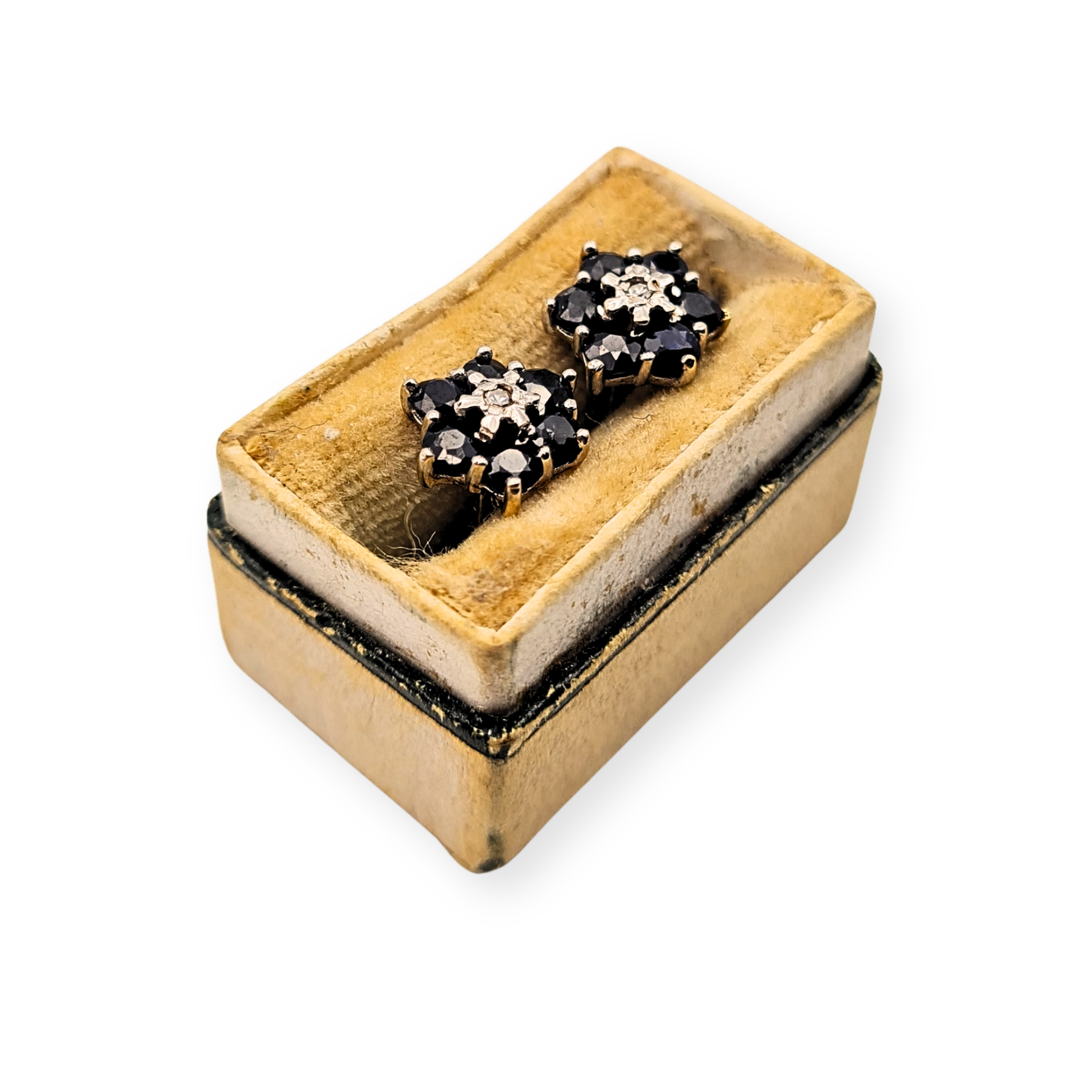 Pair of 9ct yellow gold sapphire and diamond flower cluster stud earrings, fully hallmarked, 8mm across with butterfly backs. Classic floral design featuring deep blue sapphires around a central diamond, 1.47g total weight, elegant vintage style.