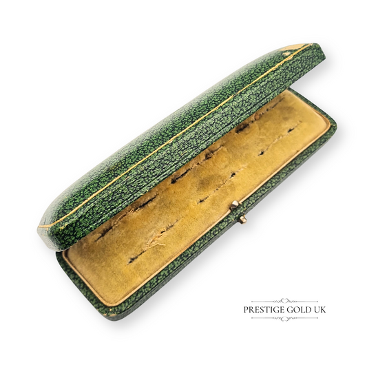 Vintage green cufflink box with gold trim, measuring 120mm x 35mm x 15mm, featuring a cream interior and secure closure. Retro jewellery storage case, ideal for cufflinks, collectibles, or display use, with age-worn character.