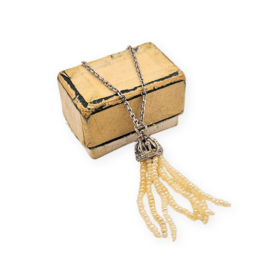 Fine platinum cable chain necklace with 18ct white gold tassel pendant set with small diamonds and multiple strands of cream seed pearls, 36cm length, unhallmarked but tested, featuring articulated fringe detail and spring ring clasp