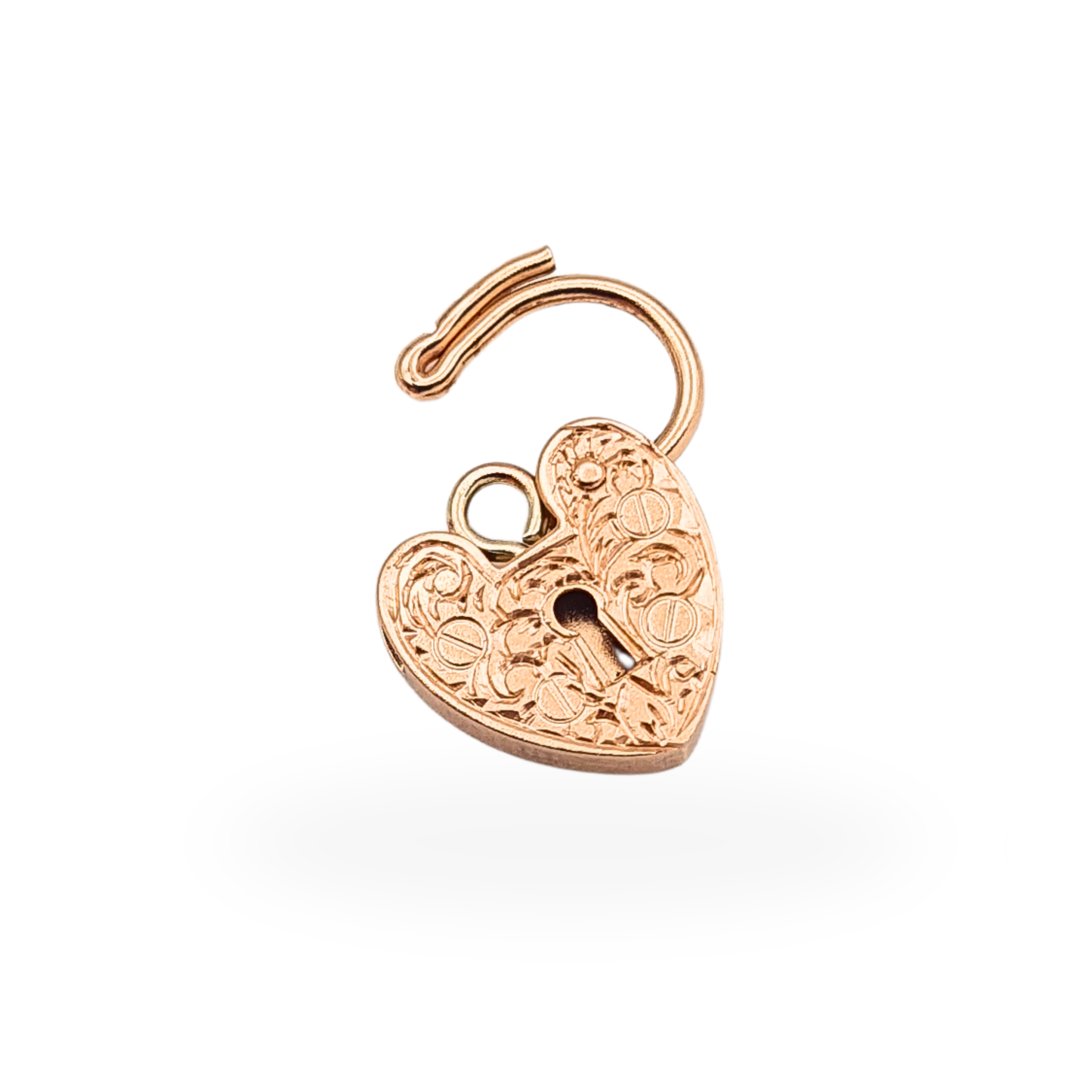 Vintage 9ct rose gold opening heart padlock charm with hand engraved floral decoration and 375 hallmark.