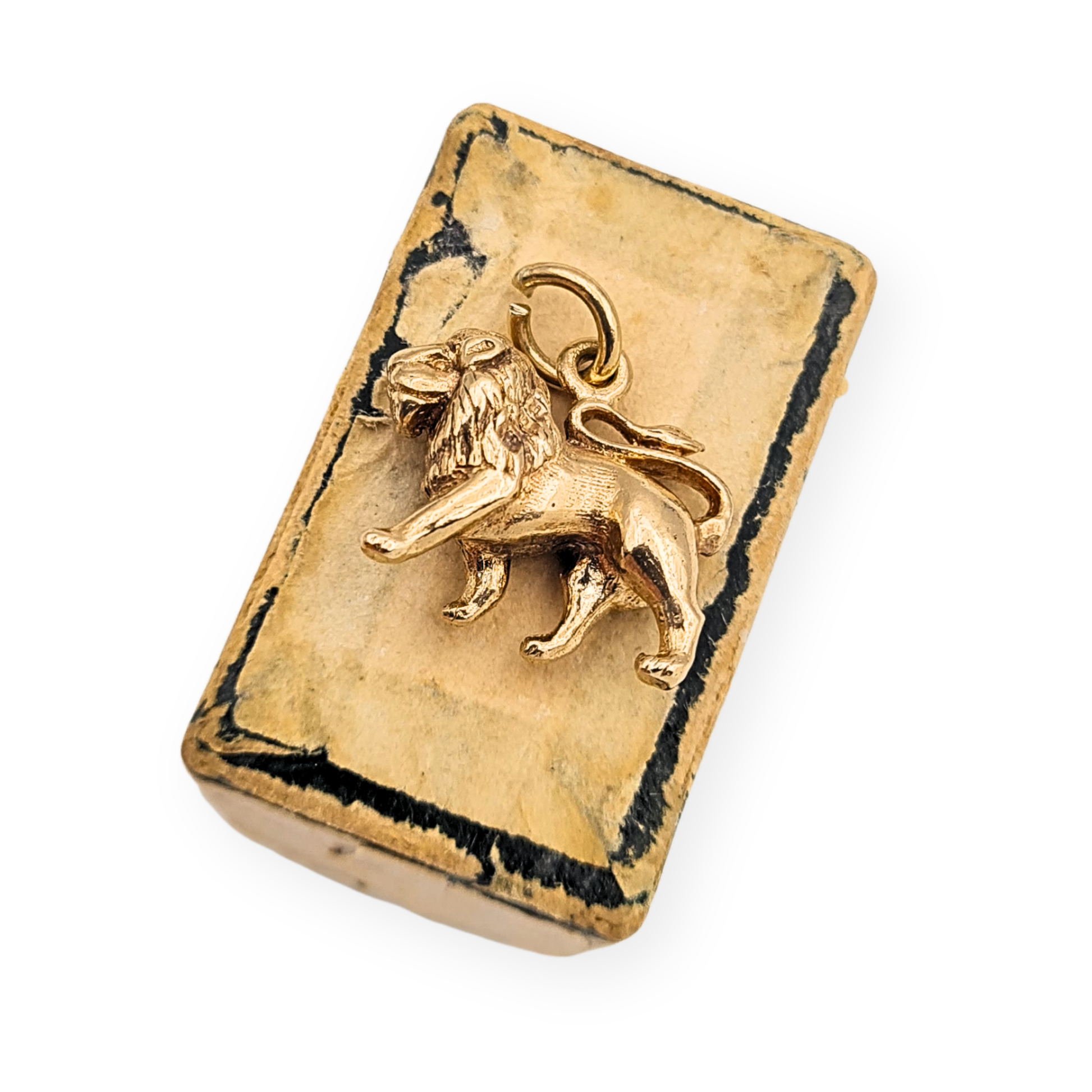 Solid 9ct gold lion charm pendant with Birmingham 1989 hallmark, measuring 14mm long, 11mm tall and 5mm wide. Detailed miniature lion with defined mane and raised stance, fully hallmarked and weighing 3.1g, ideal for bracelet or fine chain wear.
