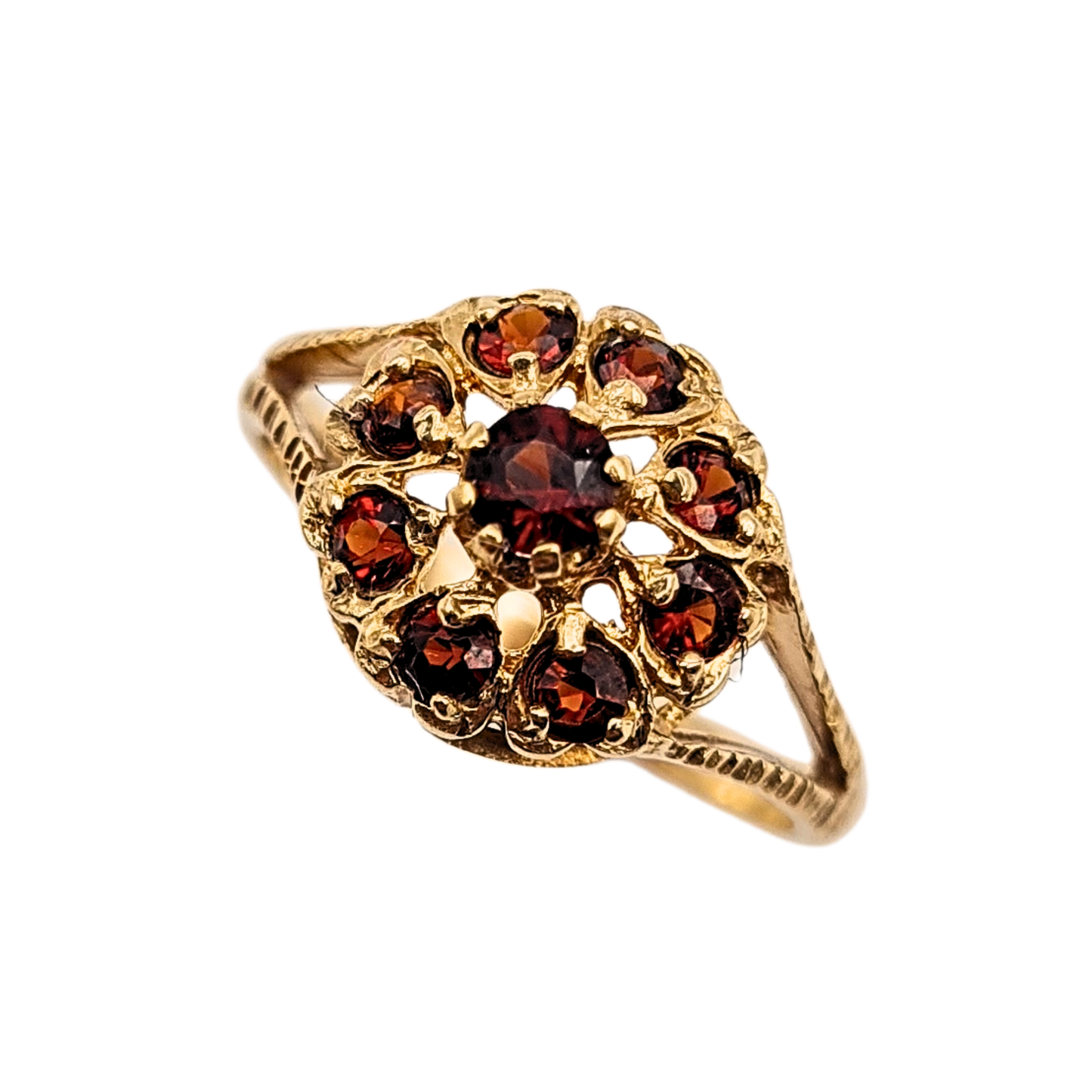 Close-up of a vintage 9ct yellow gold garnet cluster ring hallmarked Birmingham 1970, featuring a 10mm ornate openwork face with deep red round-cut garnets and decorative shoulders. UK size K 1/2 (US 5 1/2), weighing 1.91g, in excellent vintage condition.