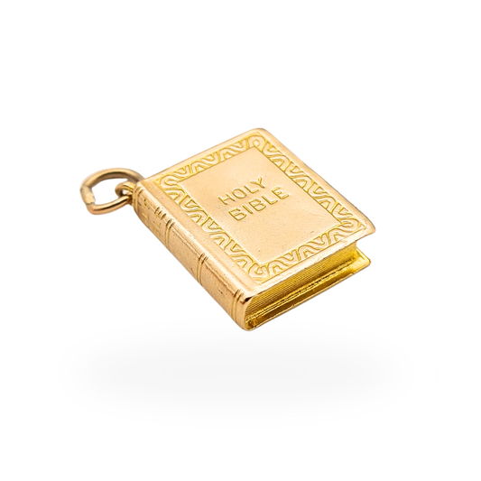Vintage 9ct gold Holy Bible book charm with Birmingham 1975 hallmark and decorative embossed cover.