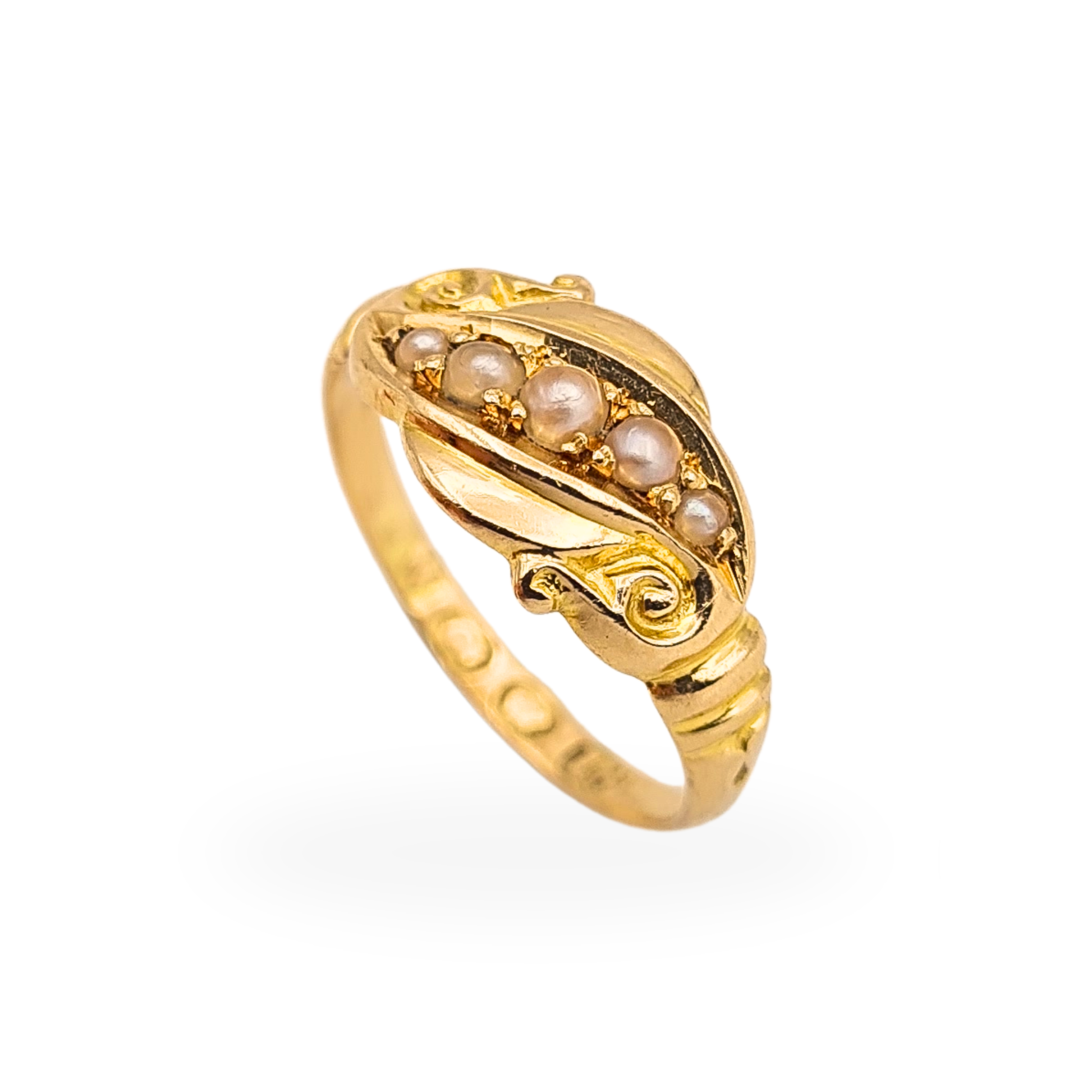 Antique 18ct gold pinky ring with five graduating seed pearls and elegant scrolling shoulders, circa 1900.
