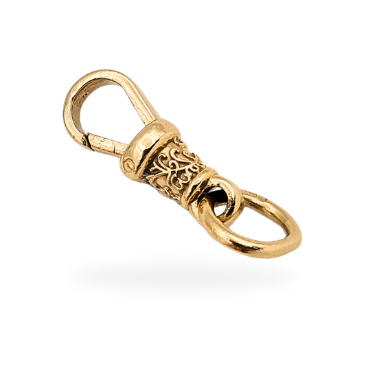 Ornate antique 9ct yellow gold Albert chain dog clip measuring 22mm long and weighing 3.8g, fitted with a large 10mm fully hallmarked jump ring, featuring a decorative engraved barrel section, classic swivel mechanism, and well-preserved antique condition shown in detail.