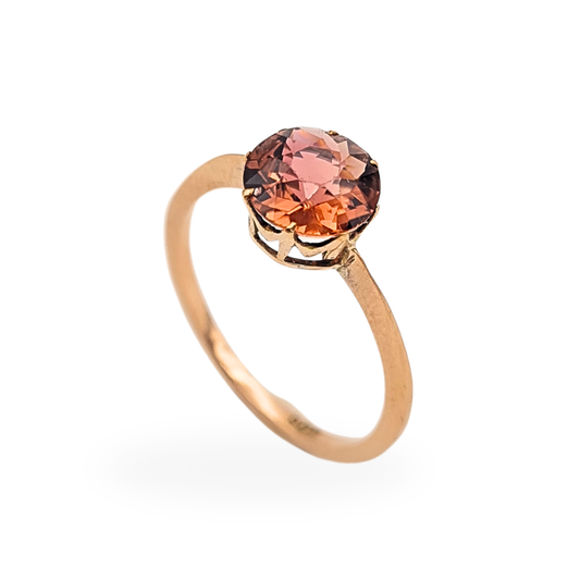 Vintage style 9ct rose gold garnet ring featuring a 7mm round cut pink garnet gemstone in a delicate handmade setting, UK size N 1/2 and US size 7, stamped 9ct. A petite early century gold gemstone ring with warm rose tone and elegant open gallery mount.

