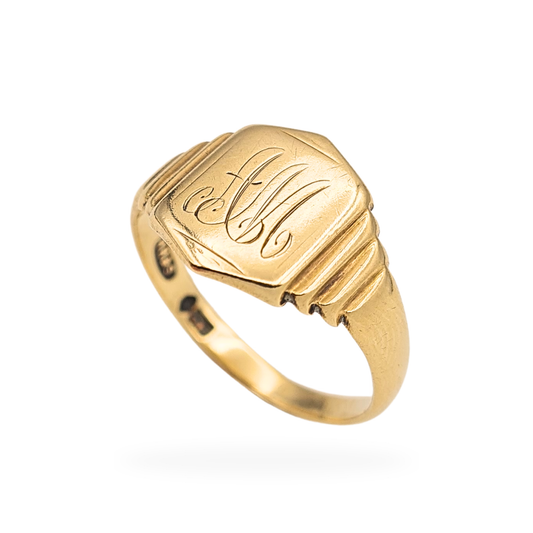 9ct yellow gold hand engraved signet ring stamped 9ct, size UK Q US 8 1/4, with a 12 x 9mm shield shaped face and stepped shoulders. Weighing 3.0g, featuring elegant script initials and a polished yellow gold band in excellent pre-owned condition.