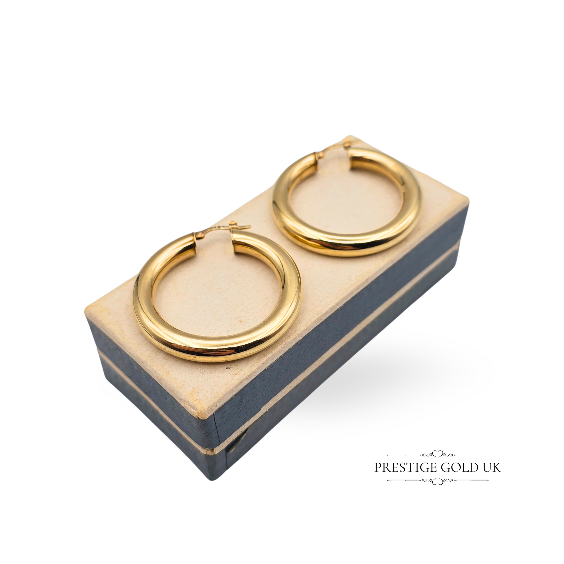 Vintage 9ct gold hoop earrings with Chester 1995 hallmark, measuring 35mm in diameter and 5mm wide. Hollow lightweight construction with flip top closure and polished retro design. Bold yet wearable classic gold hoops.