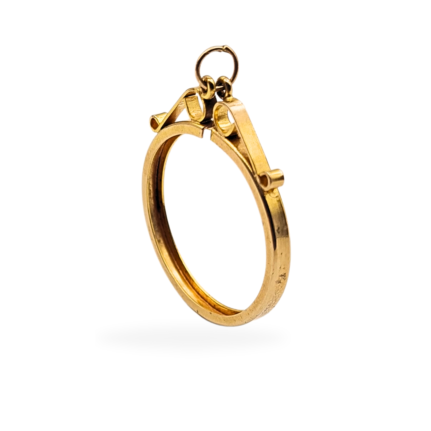 9ct gold full sovereign holder with scroll-top hinged design, London hallmarked 1972. Slim yellow gold coin mount measuring 29mm by 24mm with secure closure, designed to hold a full sovereign and suitable for wear on a chain or fob.