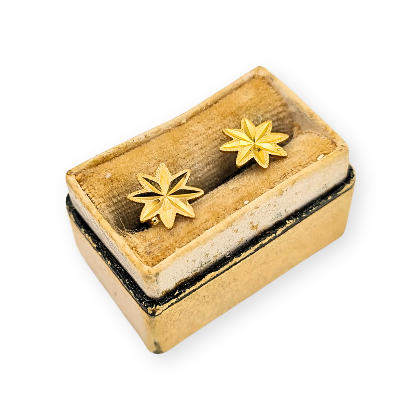 Pair of 9ct yellow gold star stud earrings with faceted engraved design, fully British hallmarked, measuring 8mm across with 10mm posts, weighing 0.52g, butterfly backs included, lightweight and elegant celestial jewellery.