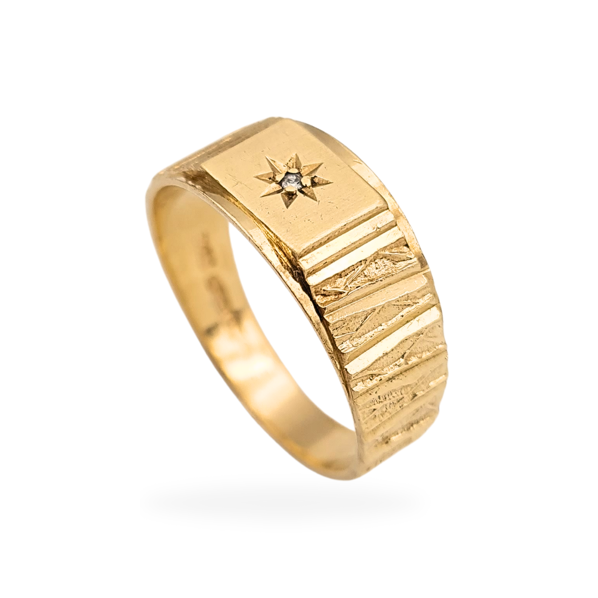 9ct gold diamond signet ring with bark-effect engraved shoulders and starburst-set diamond face. Birmingham hallmarked 1979, UK size V 1/2 US 10 3/4. Vintage yellow gold signet with 8mm face and classic British styling.