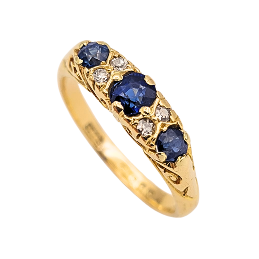 Antique 18ct gold ring set with three blue sapphires and old cut diamonds, ornate engraved shoulders, Birmingham 1922 hallmark by S Blanckensee & Son, size UK K half US 5.5 classic vintage fine jewellery piece