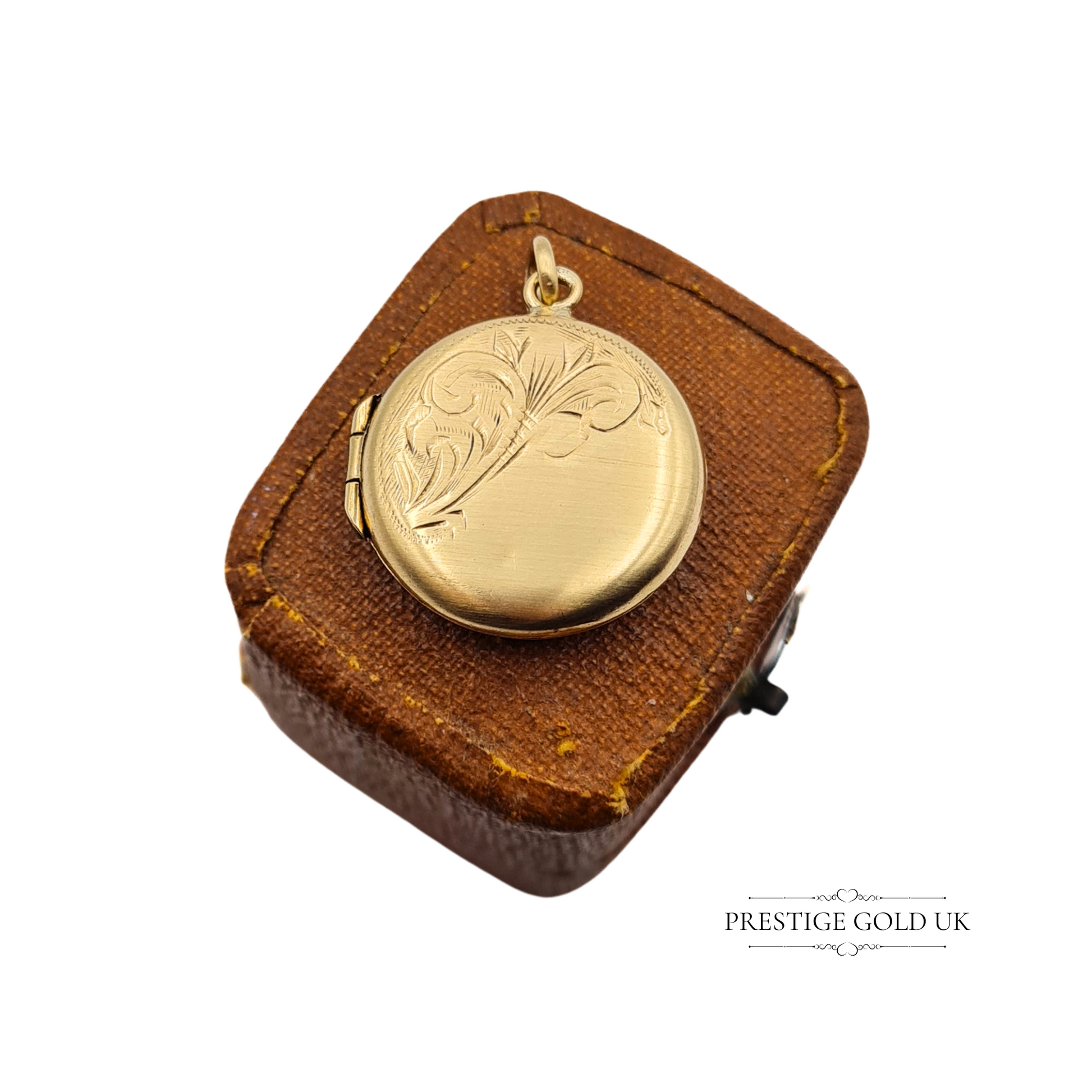 Vintage 9ct gold round photo locket with engraved floral design, hallmarked Chester 1958, displayed on a vintage leather box.