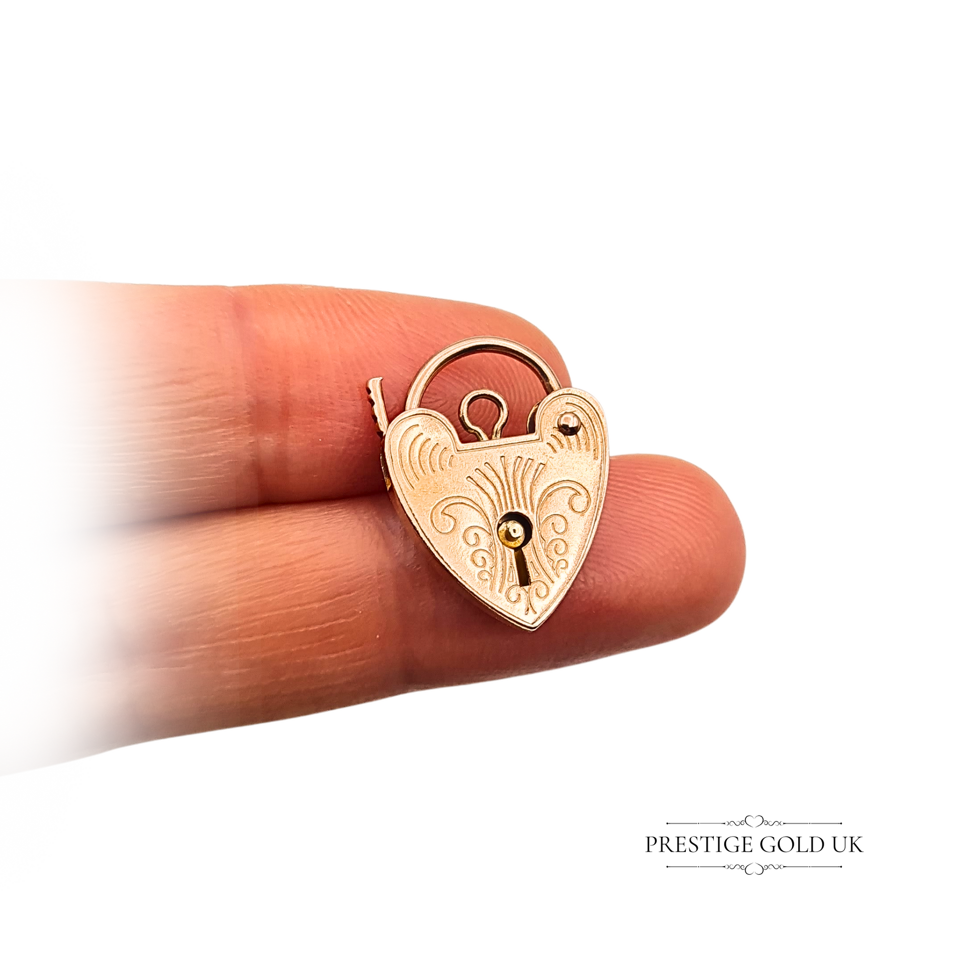 9ct rose gold vintage heart padlock charm with engraved detailing, London hallmark, weighing 2.09g, measuring 19mm tall by 15mm wide and 2.5mm deep, a romantic collectible gold pendant or clasp for bracelet or chain.