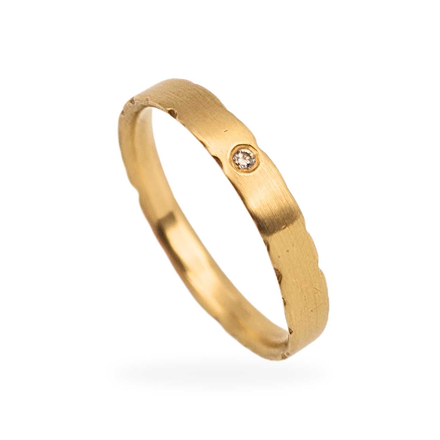9ct brushed gold wedding ring with a single flush-set diamond, fully British hallmarked, comfort fit with rough-cut wave edge, 3mm wide, UK size O 1/2 US 7 1/2, elegant matte finish perfect as a wedding or stacking ring.