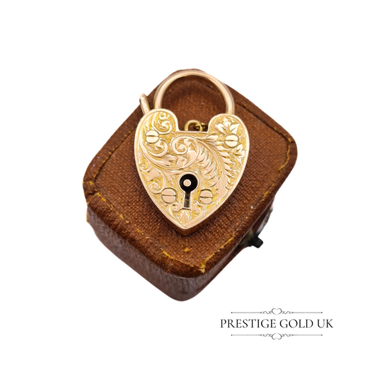 Crafted from 9ct rose gold, this beautiful vintage heart-shaped padlock pendant features exquisite hand-engraved detailing, showcasing the fine craftsmanship of the 1930s. Stamped with W.J.S. (W J Sutton Ltd, Birmingham), it embodies timeless &nbsp;elegance. The pendant's large size and unique design make it a versatile addition to a bracelet or necklace chain. Perfect for collectors or as a thoughtful vintage gift. Only one available—truly one-of-a-kind.
