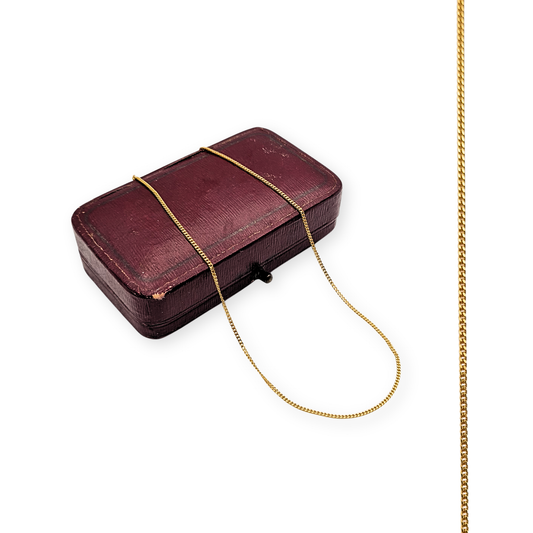 9ct solid gold dainty curb chain necklace, 17.5 inches (45cm) long, 1mm wide, with spring ring clasp and full British hallmark. Weighs 1.53g. Clearance item with a small kinked link, perfect for pendants or layering.