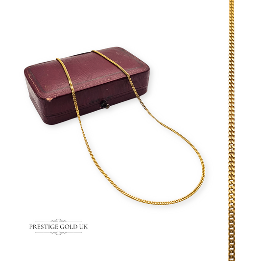 Solid 9ct gold curb chain necklace, 16 inches (41cm) long and 1.5mm wide, weighing 2.3g, fully British hallmarked with a secure spring ring clasp. A narrow, elegant gold necklace suitable for layering or everyday wear.