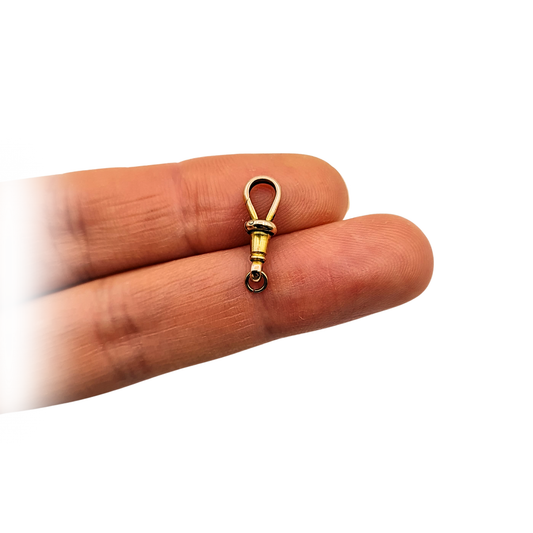 Antique 9ct rose gold Albert chain dog clip measuring 15mm long, stamped 9ct and tested, shown from multiple angles to highlight the classic swivel clasp design, warm rose gold tone, petite scale, and well-preserved antique condition suitable for watch or chain use.