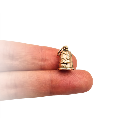 Tiny 9ct gold sewing thimble charm with textured detail and jump ring