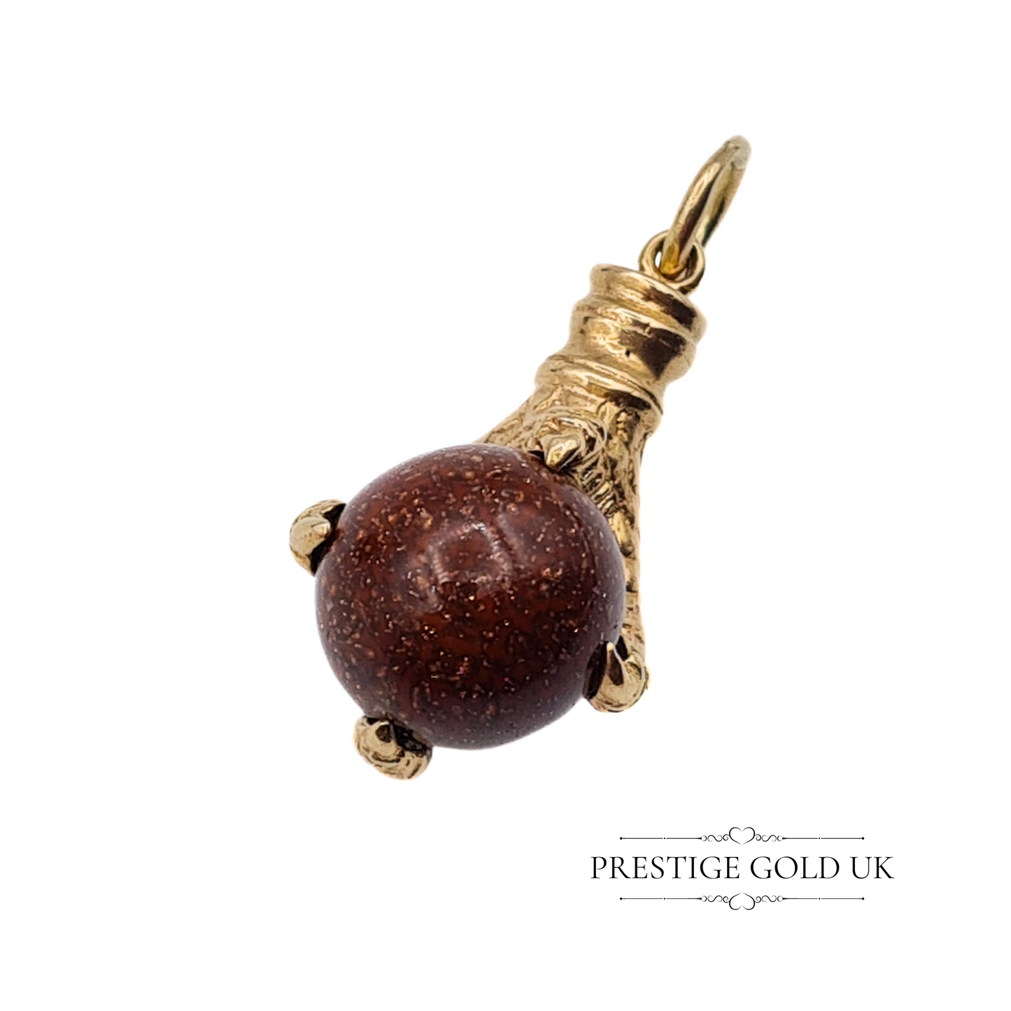 Bottom view of the eagle claw charm, showing the textured talons wrapping around the moonstone sphere.