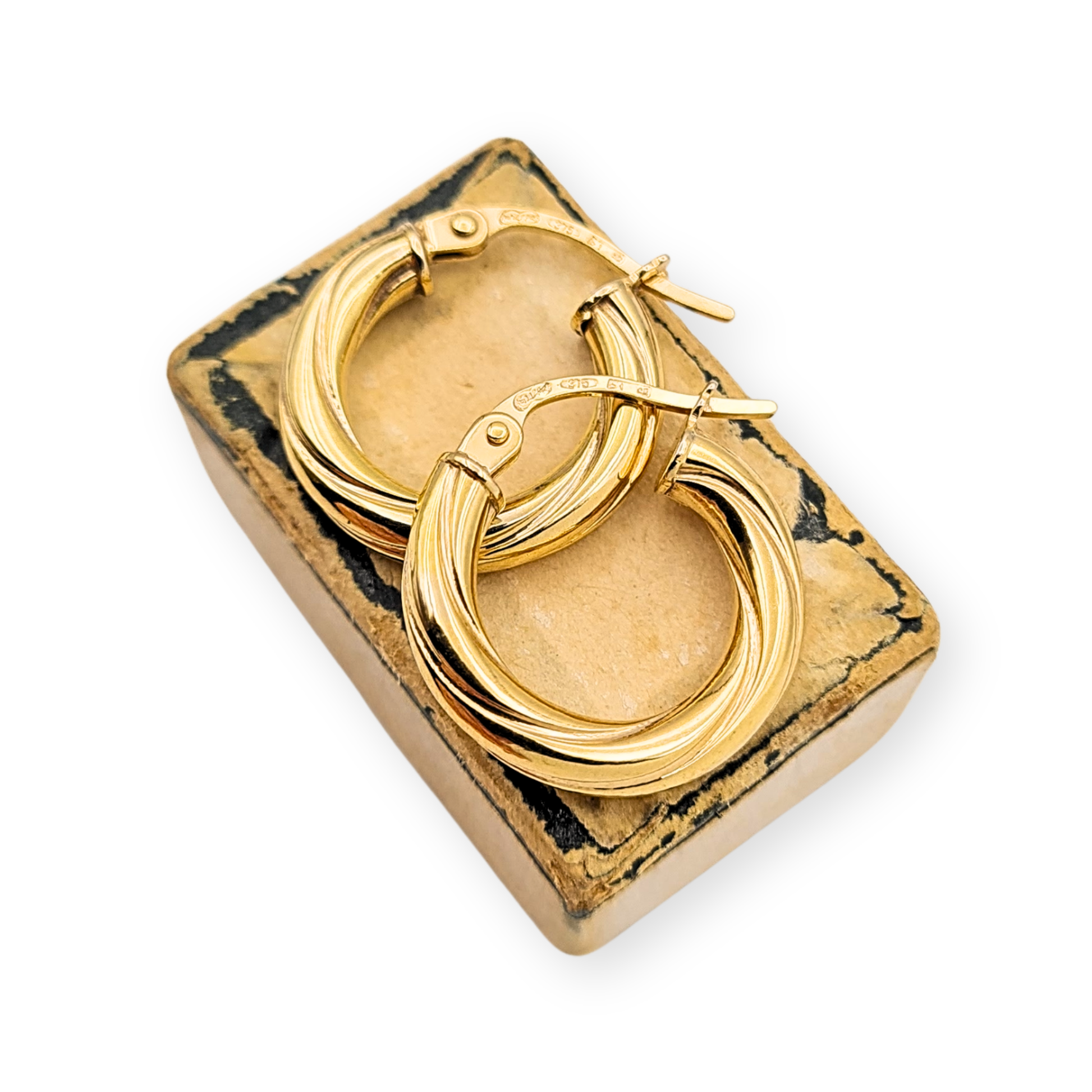 Pair of 9ct yellow gold twist hoop earrings with flip-top fasteners, fully British hallmarked, measuring 15mm in diameter and 3mm wide, weighing 0.91g, chunky hollow design with a polished finish, elegant lightweight everyday wear.