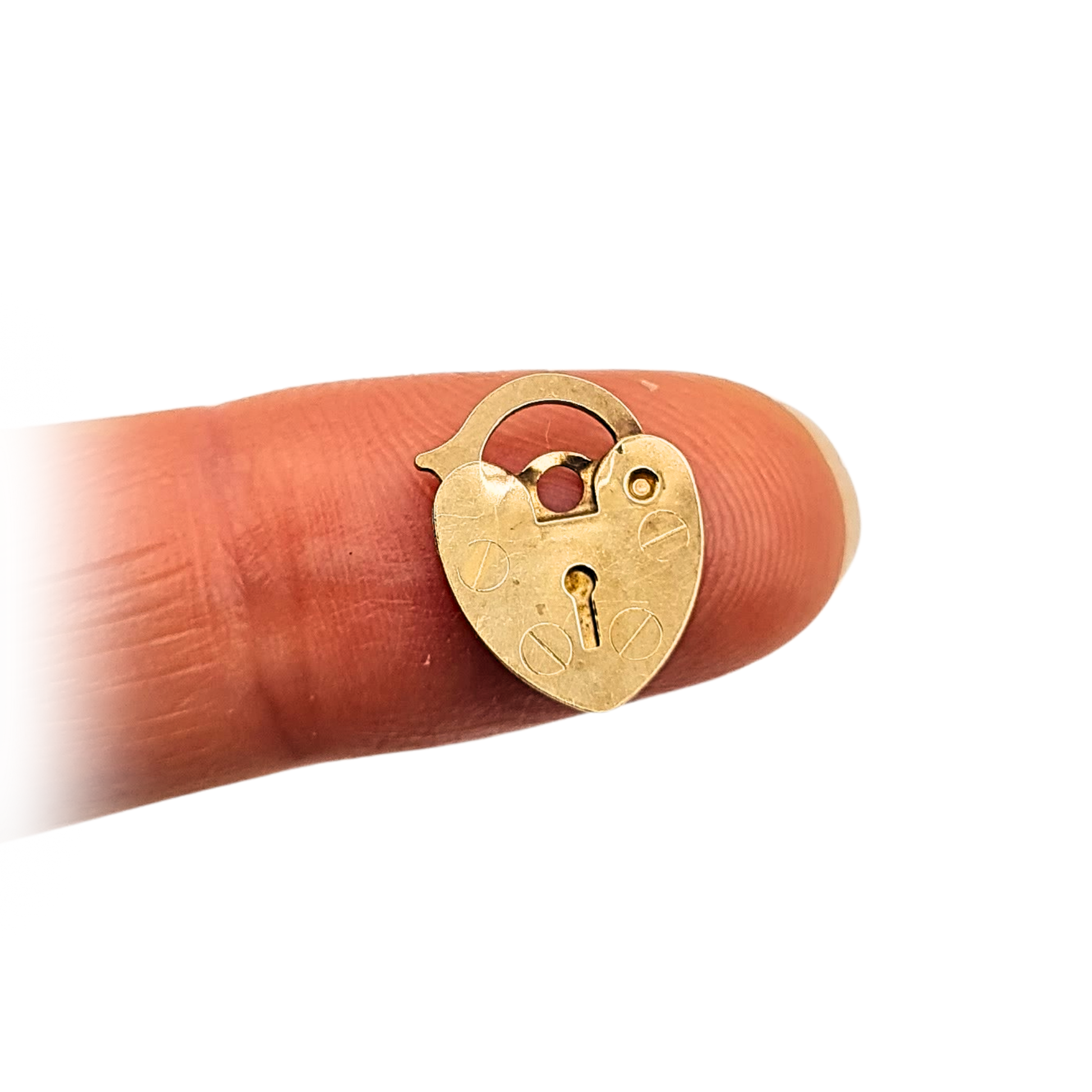Tiny solid 9ct yellow gold heart-shaped padlock, stamped 375 and fully tested, measuring 13mm x 10mm x 0.5mm and weighing 0.33g. Features engraved screw detail and working clasp, ideal as a charm or fine bracelet clasp.
