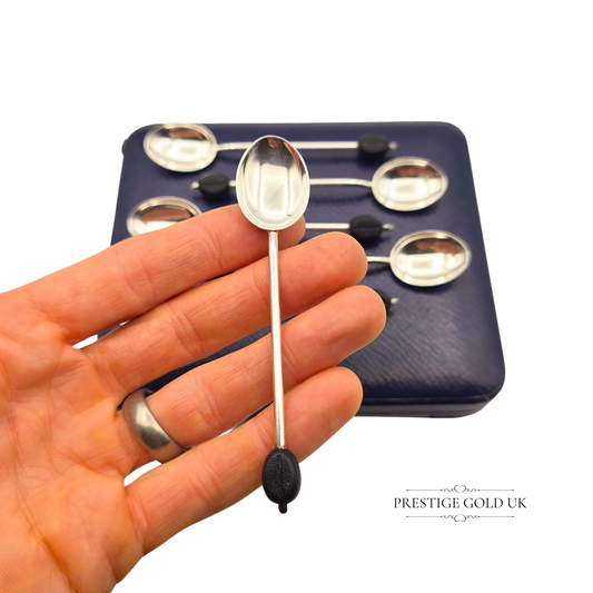 Set of six vintage sterling silver coffee bean spoons, hallmarked Birmingham 1936, each 4 inches long with black bean finials in an Art Deco style, presented in the original fitted display case.