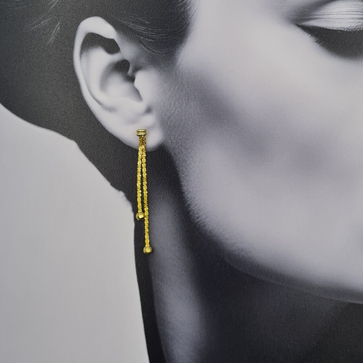 9ct yellow gold 54mm long chain drop earrings with twin dangling chains, faceted round glitter ball ends and butterfly backs