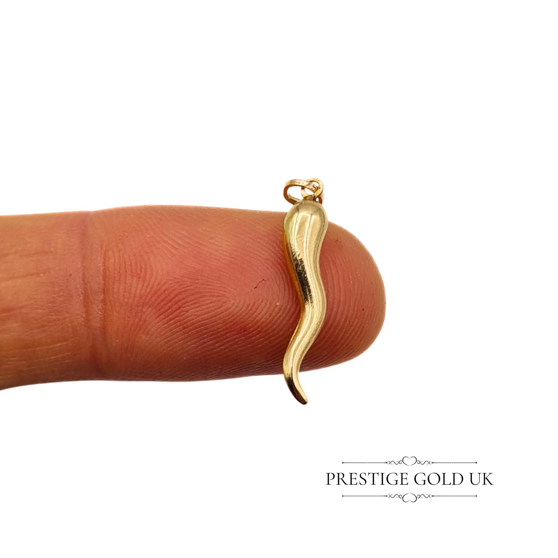 Lightweight vintage gold charm of an Italian Cornicello horn, hollow construction, weighing 0.5g, ideal for a charm bracelet or as a pendant necklace.