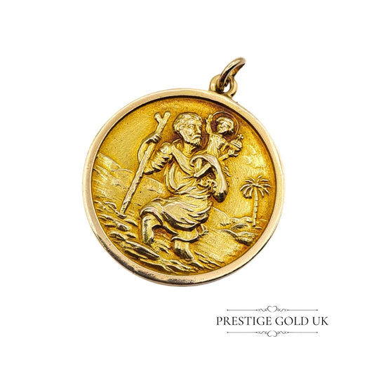 A vintage 9ct gold St Christopher pendant with a raised depiction of St Christopher carrying Christ, fully hallmarked Birmingham 1965.