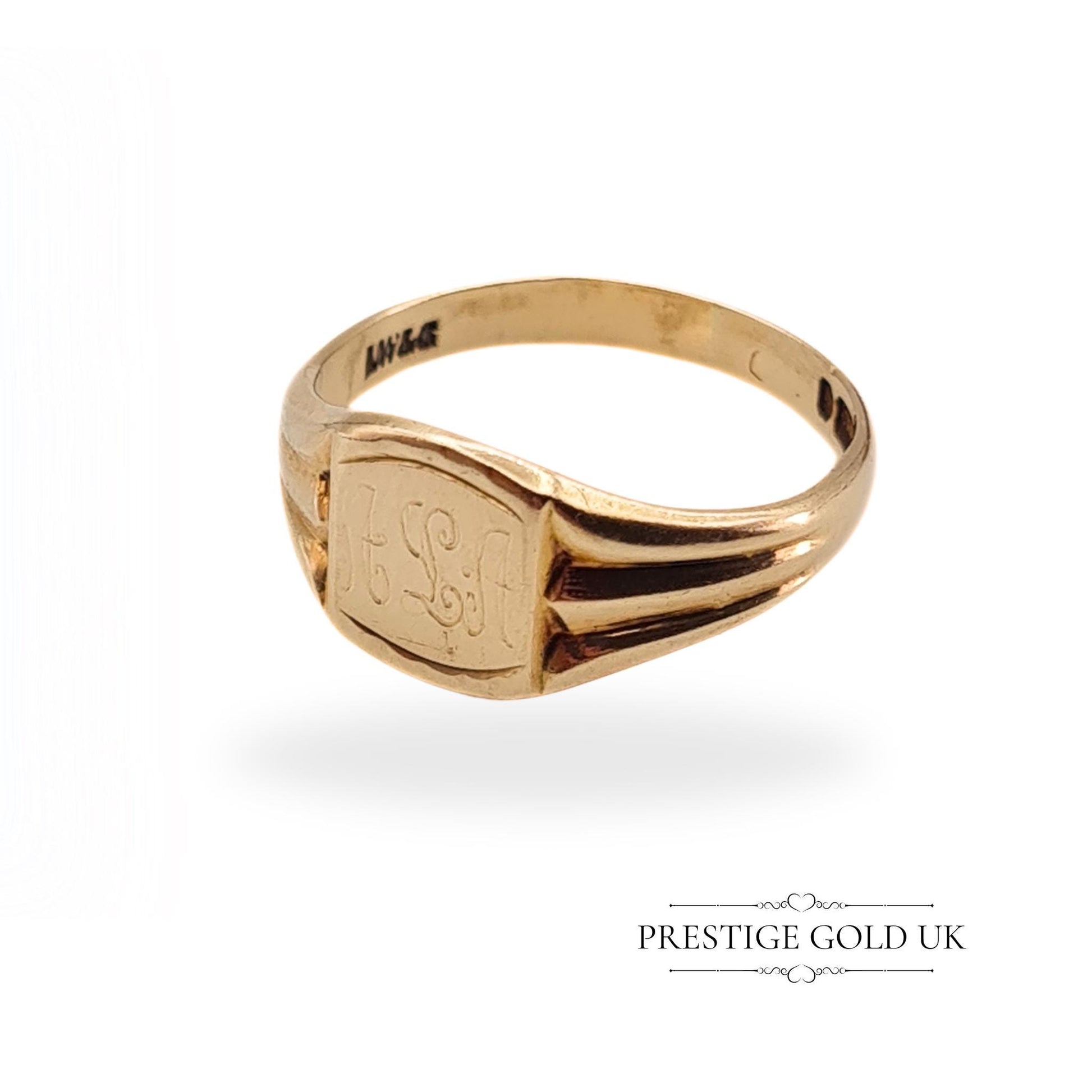 Side view of the vintage 9ct gold signet ring, showing the split shank design and elegant engraving.