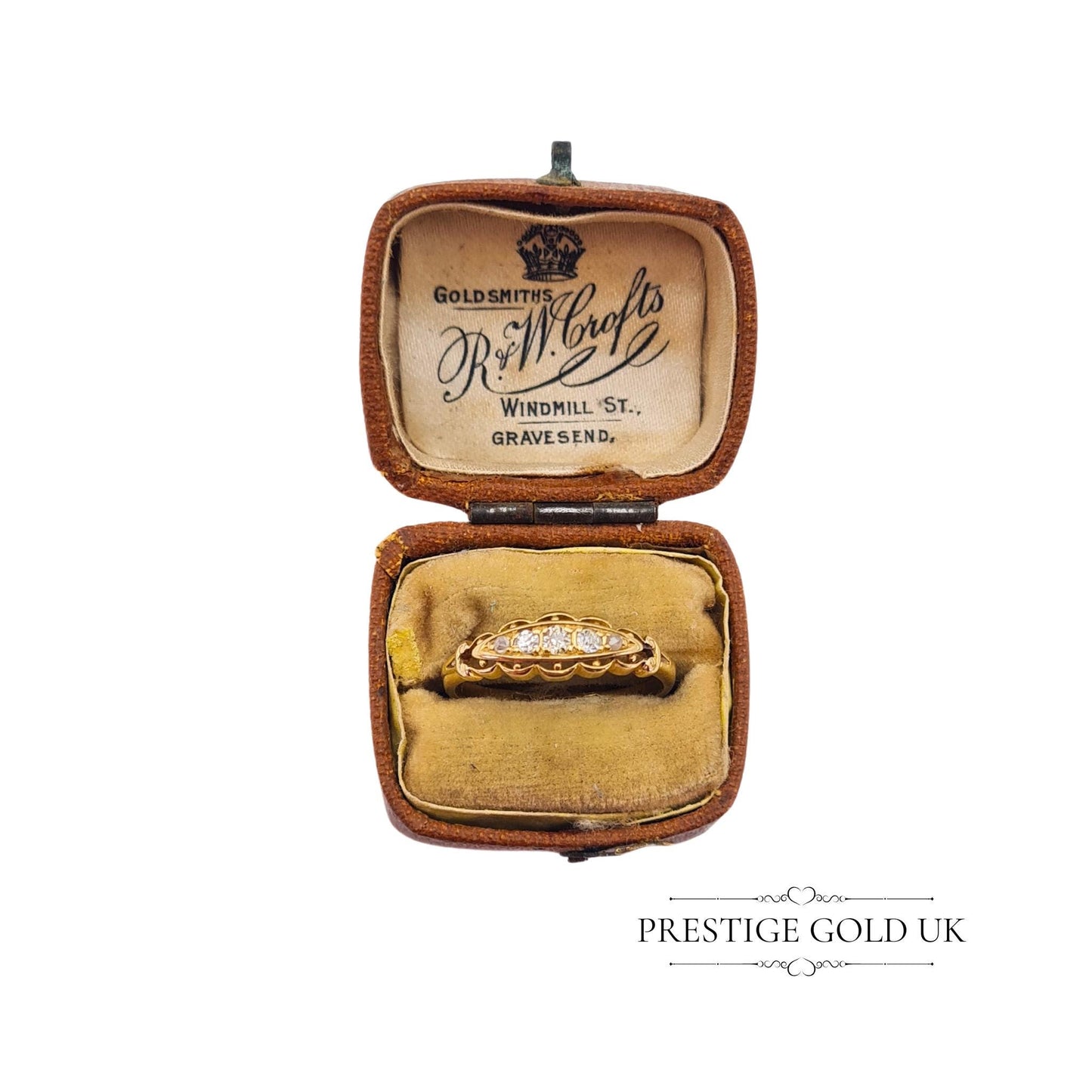 Rare Georgian-era gold ring with old-cut diamonds, photographed in an antique jewellery box.