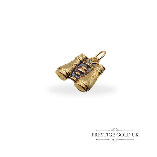 A 9ct gold binoculars charm with intricate miniature detailing, measuring 13mm long, 11mm wide, and 3mm deep. Fully hallmarked in London, lightweight at 0.75 grams. Suitable as a pendant or charm for travel-themed jewellery.