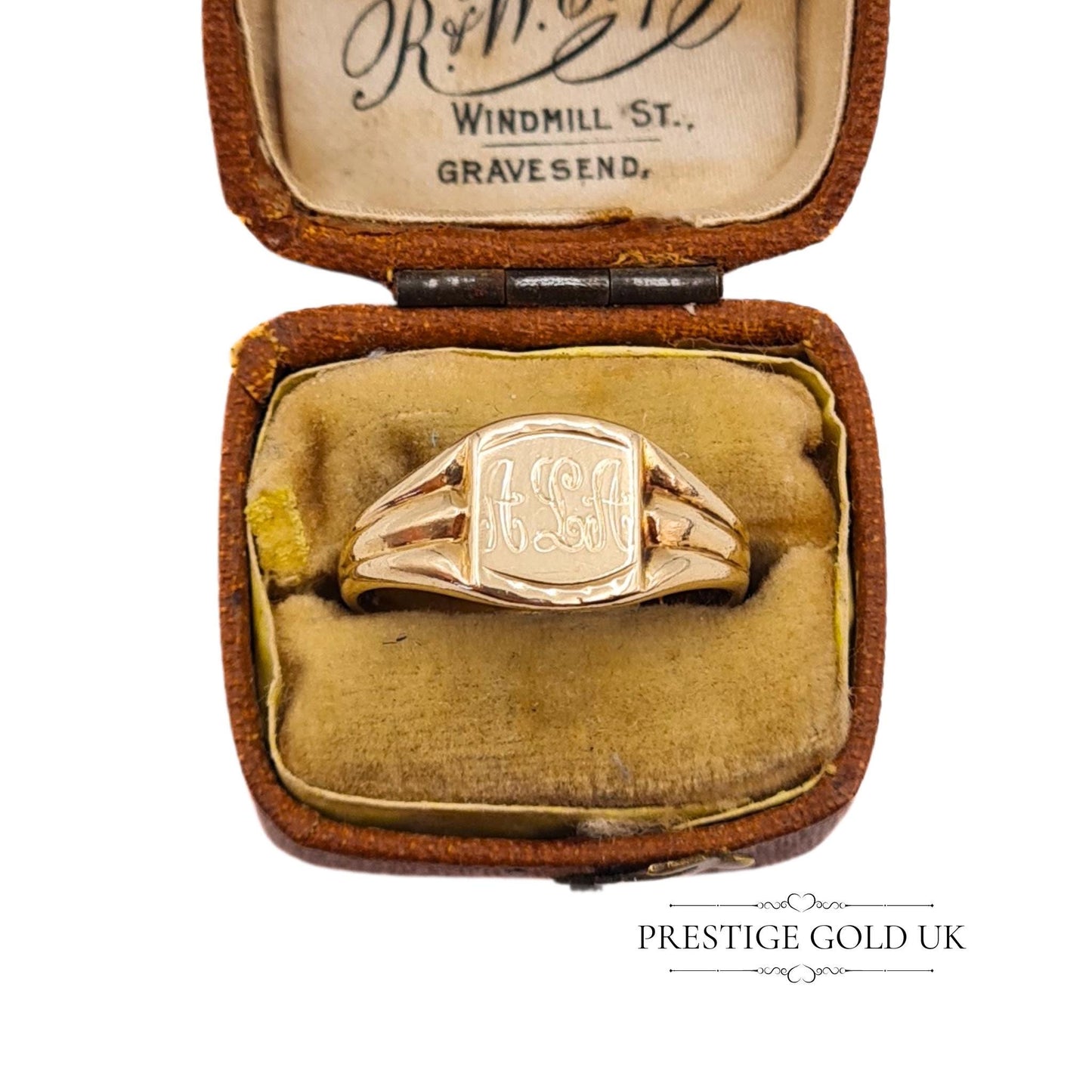 The signet ring displayed in an antique jewellery box from R.W. Crofts, enhancing its vintage authenticity.