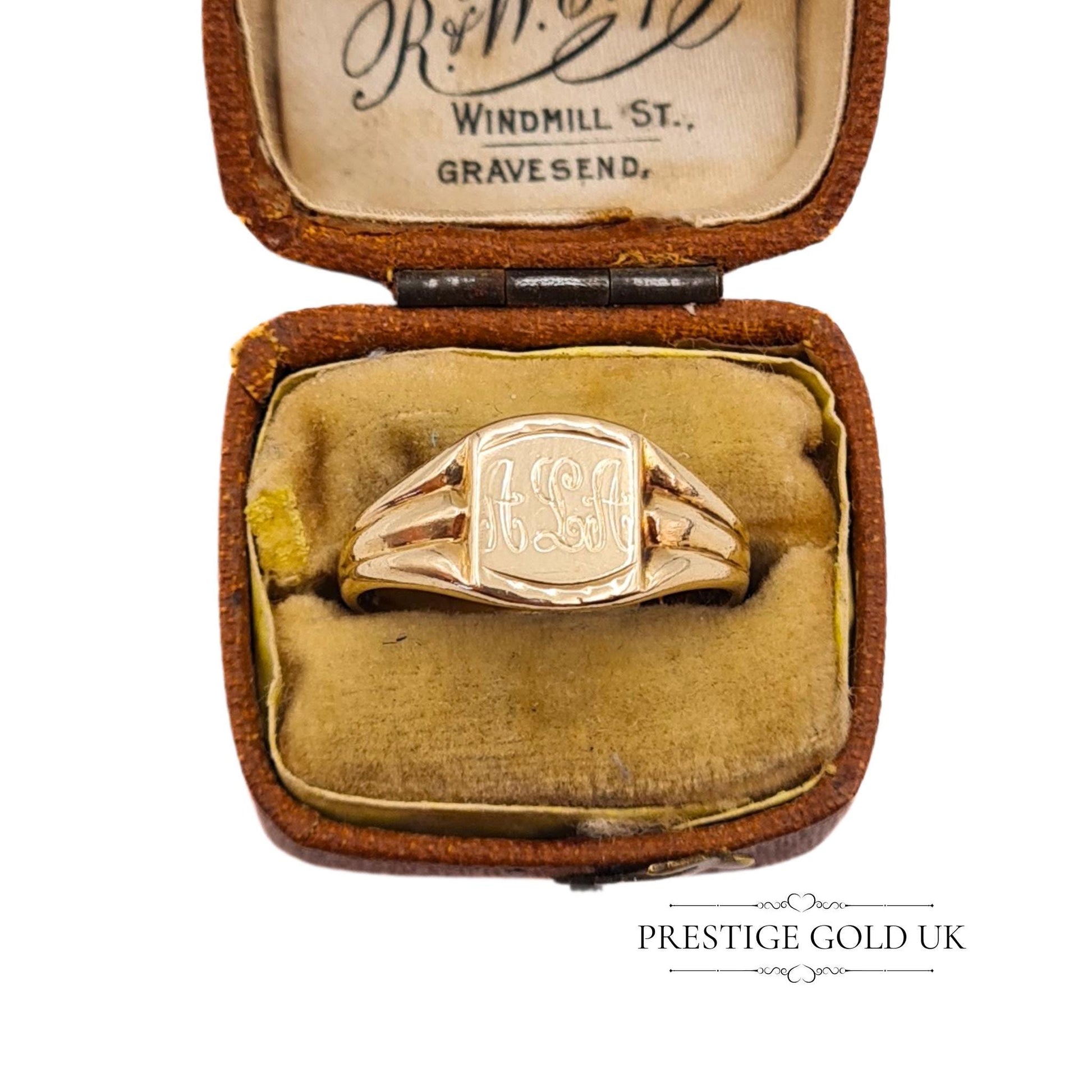 The signet ring displayed in an antique jewellery box from R.W. Crofts, enhancing its vintage authenticity.