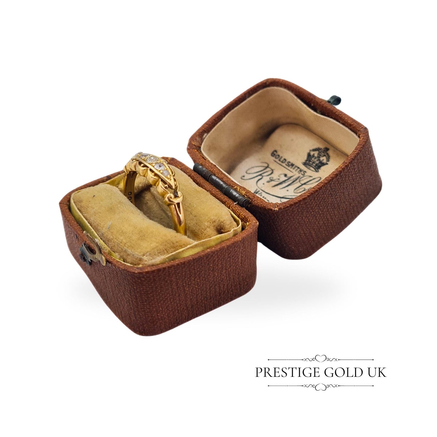 Side view of an antique 18ct gold ring, highlighting its elegant boat-shaped design and diamond arrangement.
