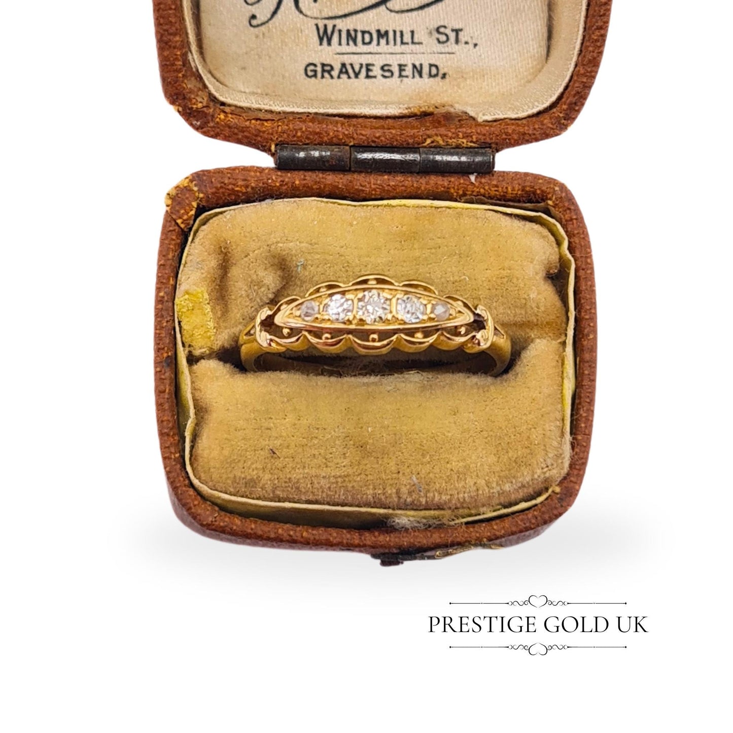 Detailed view of a fully hallmarked Chester 18ct gold ring from 1911, with a distinctive boat-shaped setting.